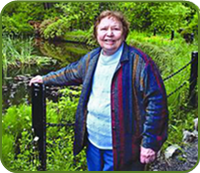 Mrs. Joan Outerbridge Mrs. Outerbridge standing in her park